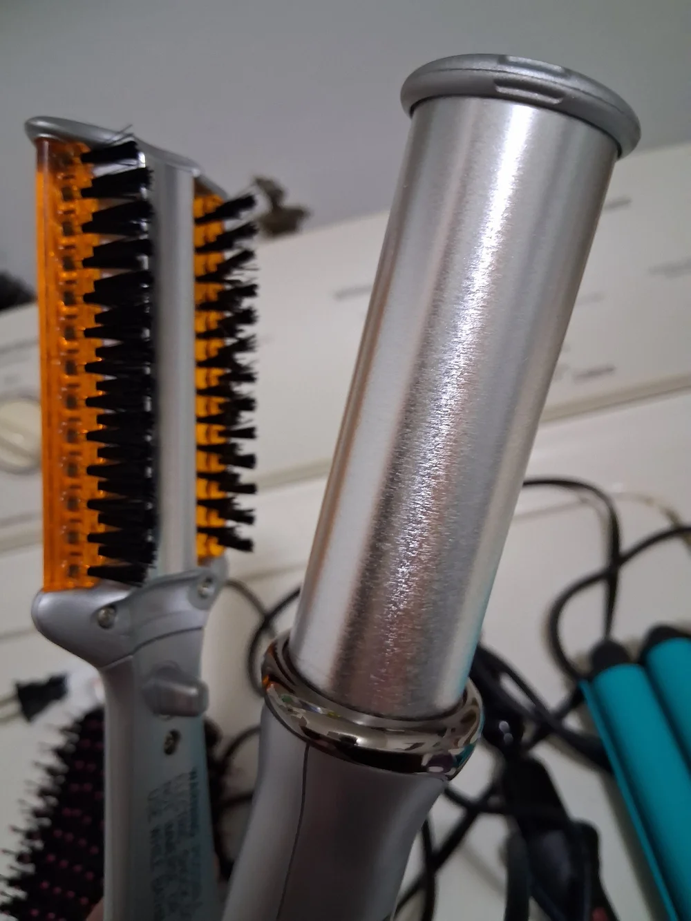Pink and Black Hot Air Hair Brush Dryer And Various Styling Items